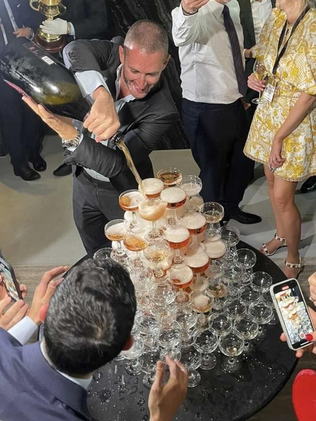 Sokolski pours a champagne tower at the winner’s party at Society.