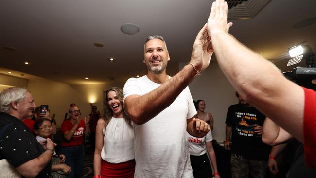 ALP candidate for Leichhardt Matt Smith and his partner Renee Kerr are congratulated by supporters at the post election party, held at the Novotel, as the vote count looks increasingly likely he will win the seat from retiring Member of Parliament Warren Entsch. Picture: Brendan Radke