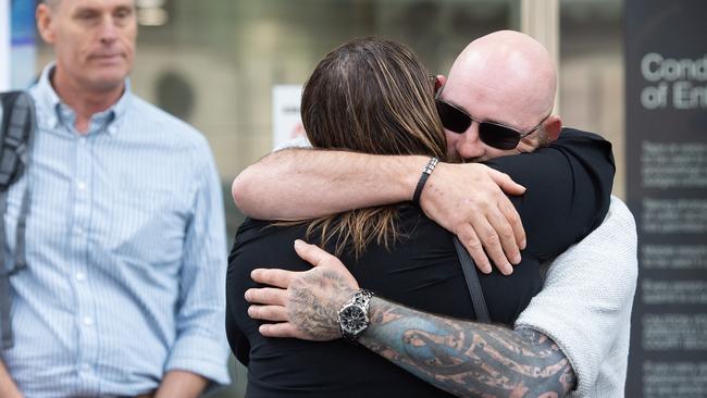 Ms Boyce is comforted by surviving victim Shaun Kilmartin. Picture:NCA Newswire / Nicki Connolly