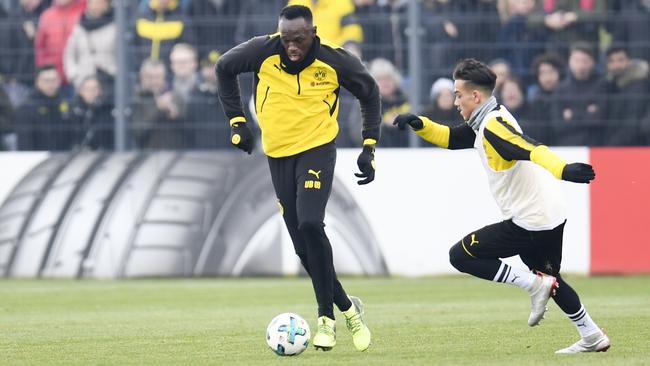 Retired Jamaican Olympic and World champion sprinter Usain Bolt plays the ball as he takes part in a training session of German first Bundesliga football team Dortmund. Picture: Patrik Stollarz/AFP