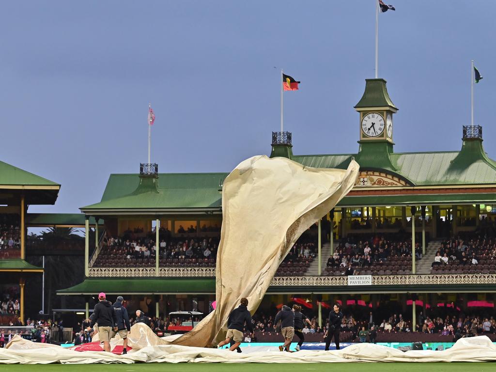 Pitch covers are blown off by strong winds as the match is halted at Sydney Cricket Ground. Picture: Getty Images