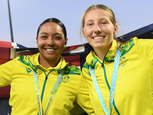 BIRMINGHAM, ENGLAND - AUGUST 07: Alana King and Darcie Brown of Team Australia celebrate after being presented with the Gold Medal following the Cricket T20 - Gold Medal match between Team Australia and Team India on day ten of the Birmingham 2022 Commonwealth Games at Edgbaston on August 07, 2022 on the Birmingham, England.  (Photo by Alex Davidson/Getty Images)