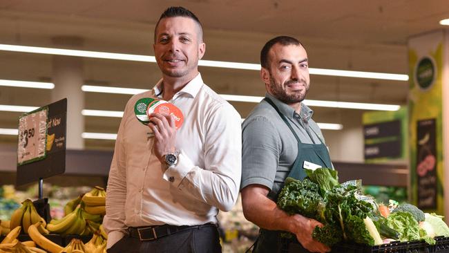 Woolworths NSW / ACT State general manager Michael Mackenzie and Fadi Jomaa at Woolworths Bass Hill supermarket for the company's $1 Feed Appeal tokens campaign. Picture: AAP-Flavio Brancaleone