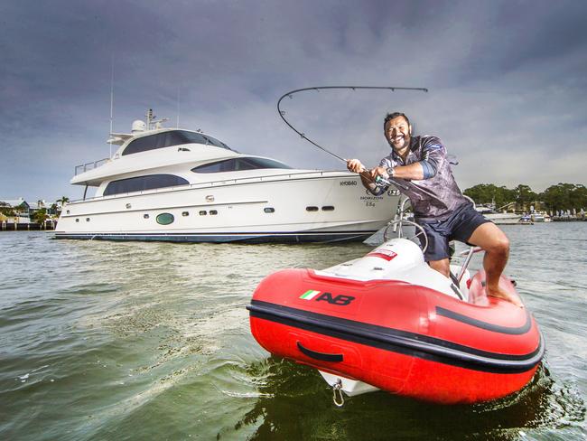 HOLD FOR COURIER MAIL FRIDAY 26TH MAY Sanctuary Cove Boat Show.Jason Chan fishing on a the RIBFORCE AB Rider (small boat at front) with the luxury poweryacht Horizon E84 in the background which will both feature at the Sanctuary Cove International Boat Show next week.Picture: NIGEL HALLETT