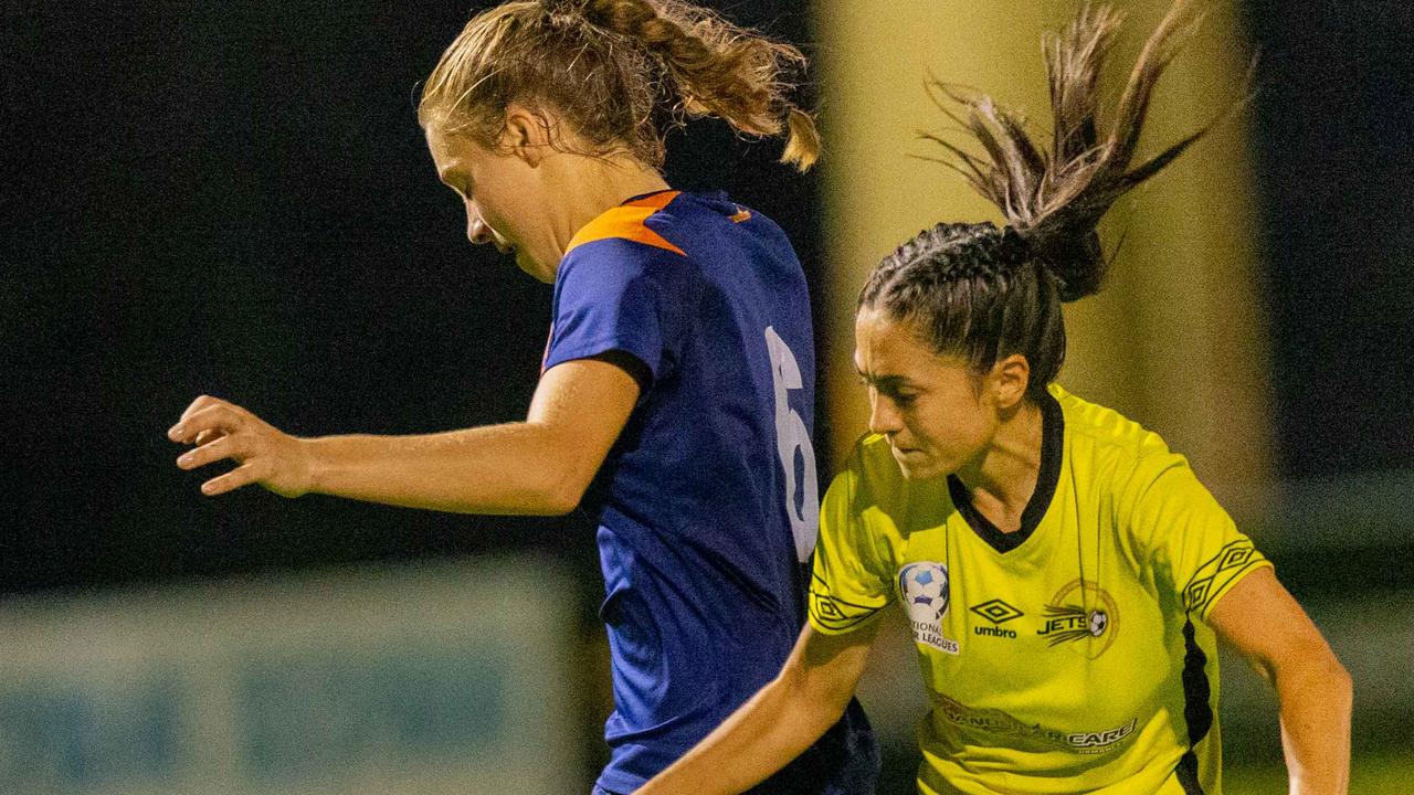 Scotie Walker (yellow shirt) challenges Jamilla Rankin (blue shirt) of Moreton Bay United Jets. Picture: Stephen Archer (Slapics)