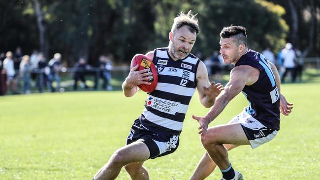 Strathfieldsaye's Shannon Geary takes possession ahead of his brother and Eaglehawk player Kallen Geary on Saturday. Picture: SAA Imaging