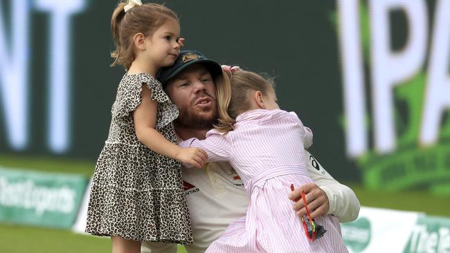 Australia's David Warner celebrates with his children after Australia beat England by 251 runs Picture: Mike Egerton/PA via AP