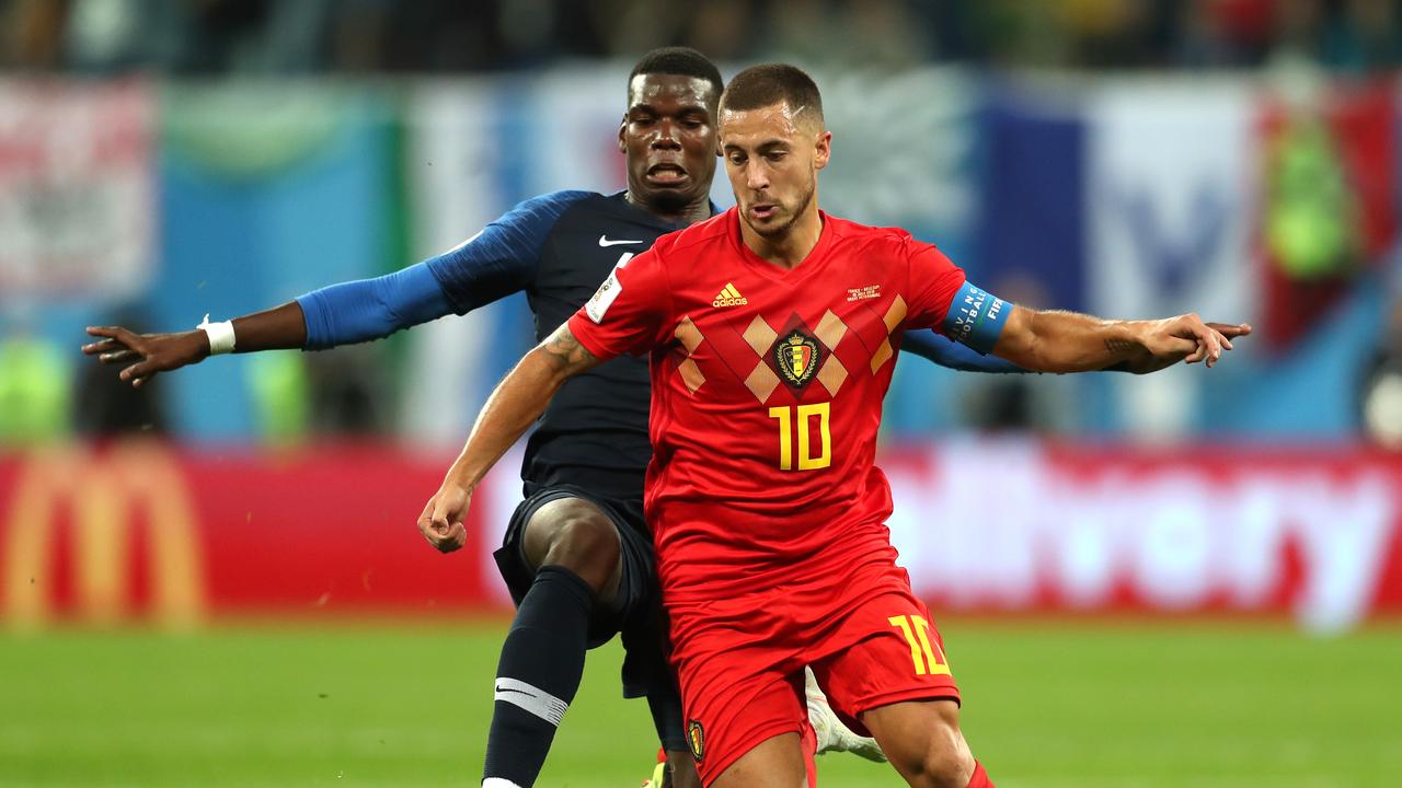 Paul Pogba of France tackles Eden Hazard of Belgium
