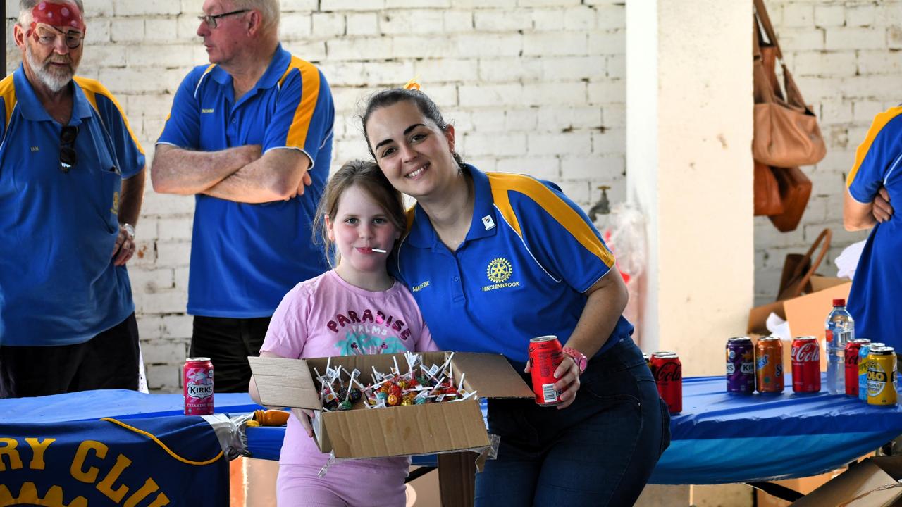 Olivia Briggs and Madeleine D'urso distributing chupa chups at the Unite for NQ event at Devietti Ag and Machinery Sales in Ingham. Generous businesses and individual Townsvillians donated thousands of dollars’ worth of badly needed goods to Hinchinbrook residents struck by the flood disaster. Picture: Cameron Bates