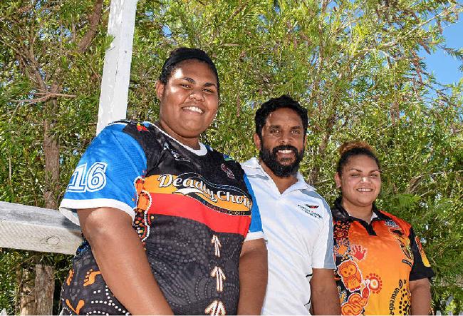 COMMUNITY ORIENTATED: Preston Campbell pictured with young fans Tahlia Tapaul, 16, and Shajuana Button, 17. Picture: Kate Darvall