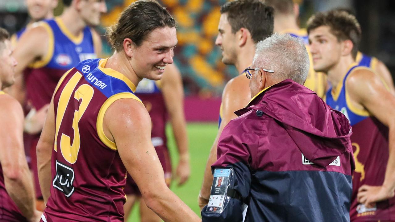 BRISBANE, AUSTRALIA - MAY 07: Thomas Berry and Chris Fagan, Senior Coach of the Lions chat post-match during the 2022 AFL Round 08 match between the Brisbane Lions and the West Coast Eagles at the Gabba on May 07, 2022 in Brisbane, Australia. (Photo by Russell Freeman/AFL Photos via Getty Images)
