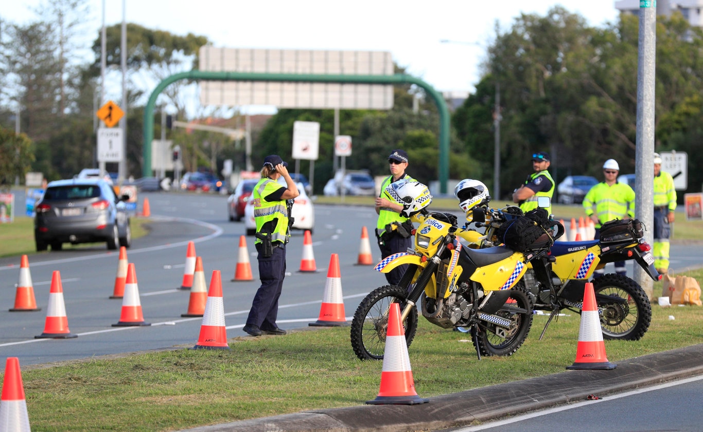 Queensland Police set up a road block due to the Corona Virus at the NSW / Queensland Border on the old Pacific Highway at Coolangatta. Photo: Scott Powick Newscorp