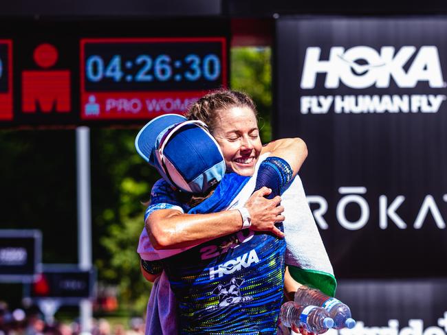 Ellie Salthouse embraces Grace Thek after she won the Ironman 70.3 Tasmania. Picture: Linda Higginson