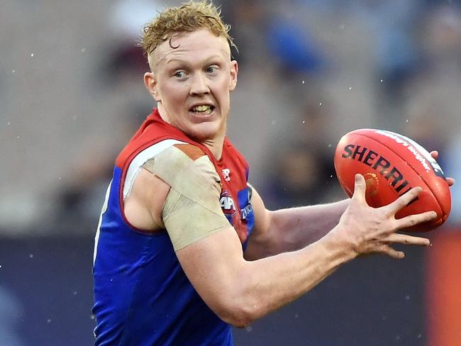 Clayton Oliver of the Demons is seen in action during the Round 16 AFL match between the Carlton Blues and the Melbourne Demons at the MCG in Melbourne, Sunday, July 7, 2019. (AAP Image/Julian Smith) NO ARCHIVING, EDITORIAL USE ONLY