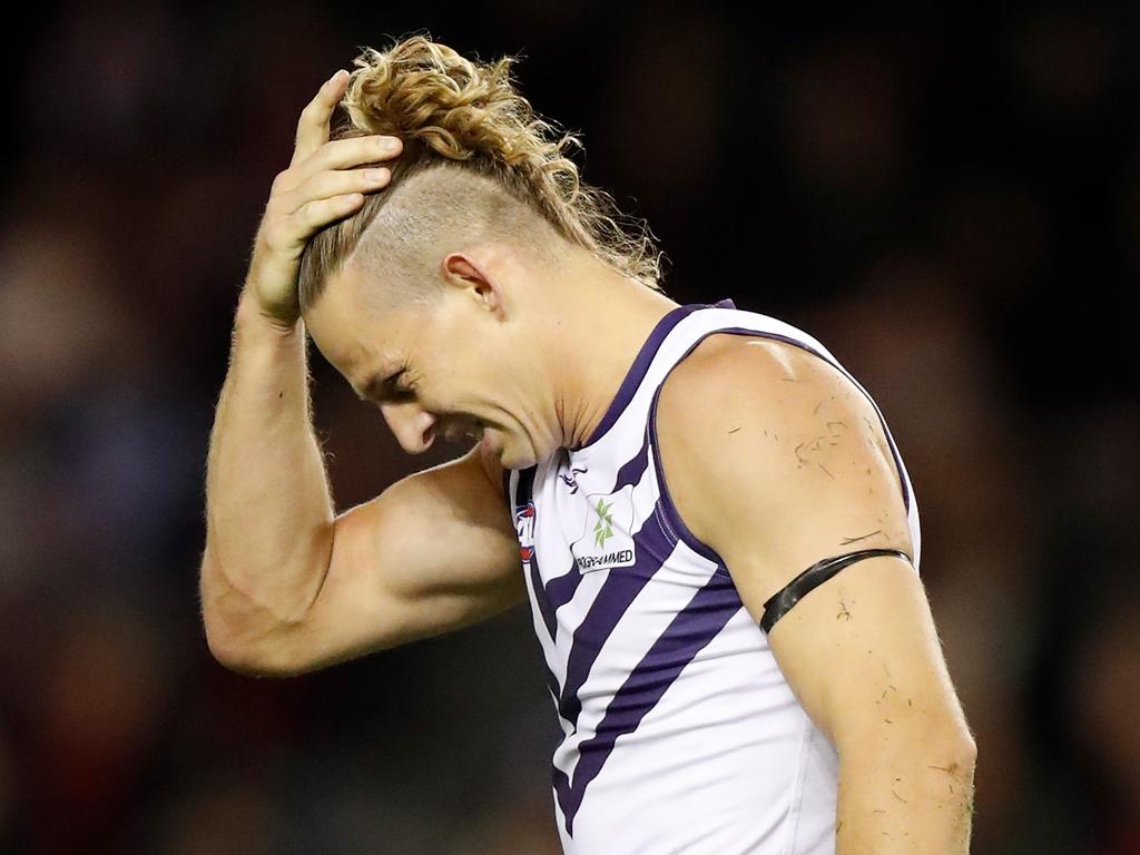 MELBOURNE, AUSTRALIA - MAY 16: Nat Fyfe of the Dockers holds his head during the 2021 AFL Round 09 match between the Essendon Bombers and the Fremantle Dockers at Marvel Stadium on May 16, 2021 in Melbourne, Australia. (Photo by Michael Willson/AFL Photos via Getty Images)