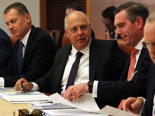 Victorian Treasurer Tim Pallas (centre) with NSW Treasurer Dominic Perrottet at the COAG Treasurers meeting on population at Parliament House in Canberra on Friday. Picture Kym Smith