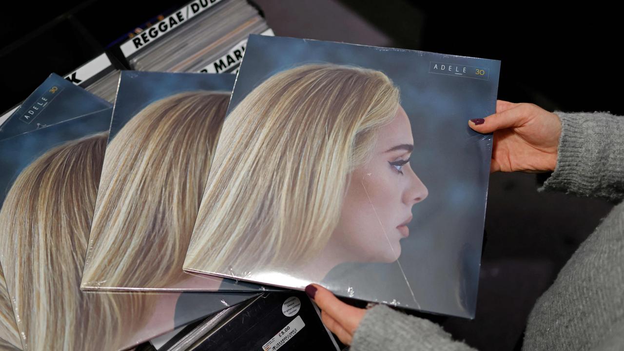 A staff member sorts copies of Adele’s new album, 30, in the Sister Ray record store in London. Picture: AFP