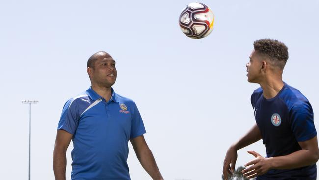 Rafael Borges Rodrigues juggles the ball with his father Cristiano. Picture: AAP/Emma Brasier