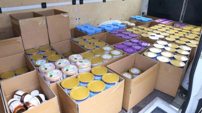 Some of the 1306 baby formula tins seized by cops as part of the alleged wider criminal syndicate. Picture: NSW Police