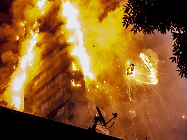 Burning cladding falls off Grenfell Tower in Latimer Road, London. Picture: Guilhem Baker/LNP