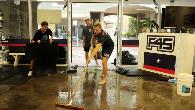 Tim Menzies sweeping out his F45 Gym on Central Ave in Manly on Tuesday afternoon. Picture: Tim Hunter.