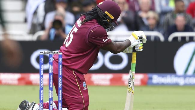 West Indies' Chris Gayle kneels at the crease during a Cricket World Cup match against Pakistan at Trent Bridge cricket ground in Nottingham, England, Friday, May 31, 2019. (AP Photo/Rui Vieira)