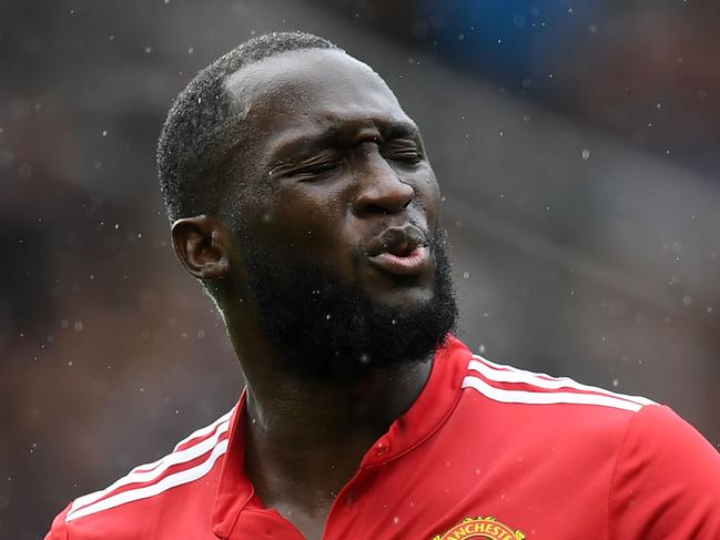 Manchester United's Belgian striker Romelu Lukaku reacts to a missed oppurtunity during the English Premier League football match between Manchester United and Crystal Palace at Old Trafford in Manchester, north west England, on September 30, 2017. / AFP PHOTO / Paul ELLIS / RESTRICTED TO EDITORIAL USE. No use with unauthorized audio, video, data, fixture lists, club/league logos or 'live' services. Online in-match use limited to 75 images, no video emulation. No use in betting, games or single club/league/player publications.  /