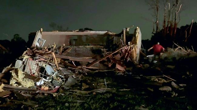 In this still image obtained from the Laurel County Fiscal Court in Kentucky, local residents search through tornado damage in Laurel County near London, Kentucky, on May 17, 2025. Picture: AFP