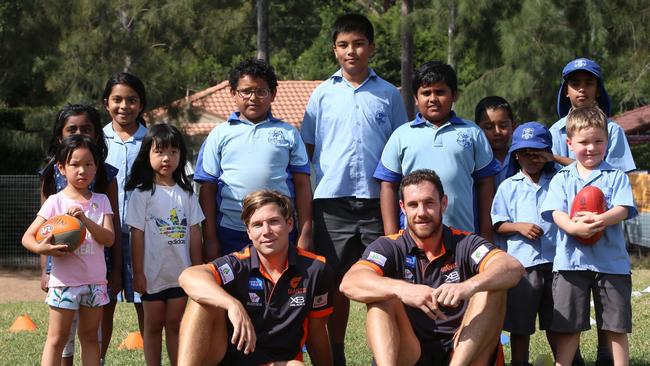 Giants Toby Greene and Shane Mumford took footy to Matthew Pearce public school in Baulkham Hills this week. Pic: Damian Shaw