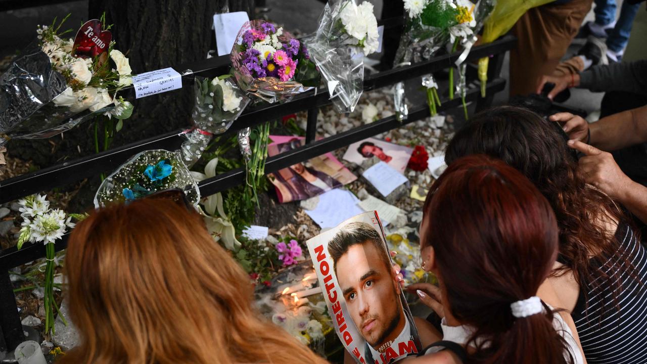 One Direction fans leave tributes outside the CasaSur hotel. Picture: Luis Robayo/AFP