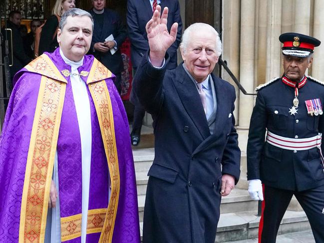 King Charles III (R) waves as he walks with Fr Dominic Robinson on after attending an Advent Service at The Jesuit Church of the Immaculate Conception, in London, on December 17, 2024. Picture: AFP