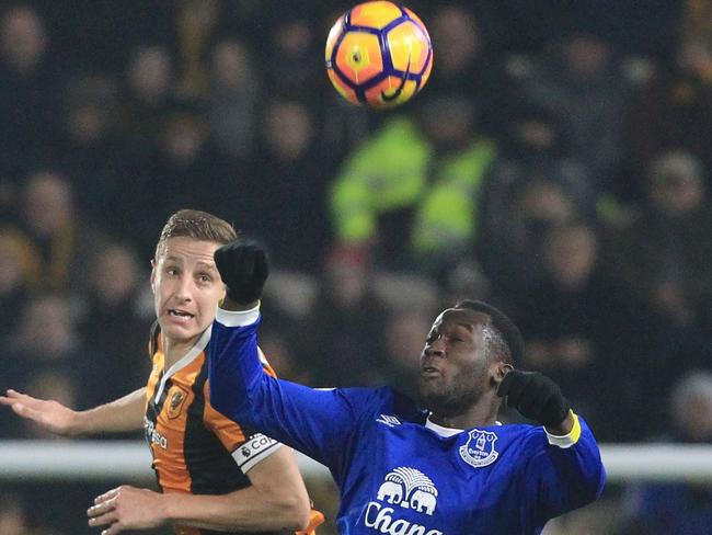 Hull City's English defender Michael Dawson (L) vies with Everton's Belgian striker Romelu Lukaku.