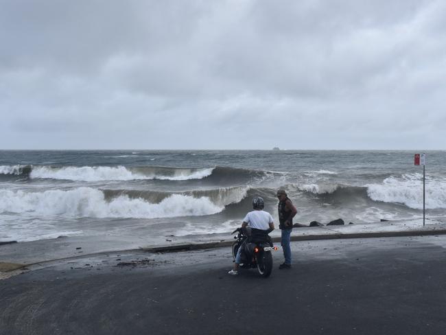 Main beach in Byron Bay remained closed but many visitors and residents decided to go and check out the high tide on Tuesday morning.