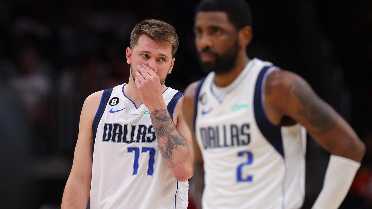 Luka Doncic #77 and Kyrie Irving #2 of the Dallas Mavericks react. Kevin C. Cox/Getty Images/AFP