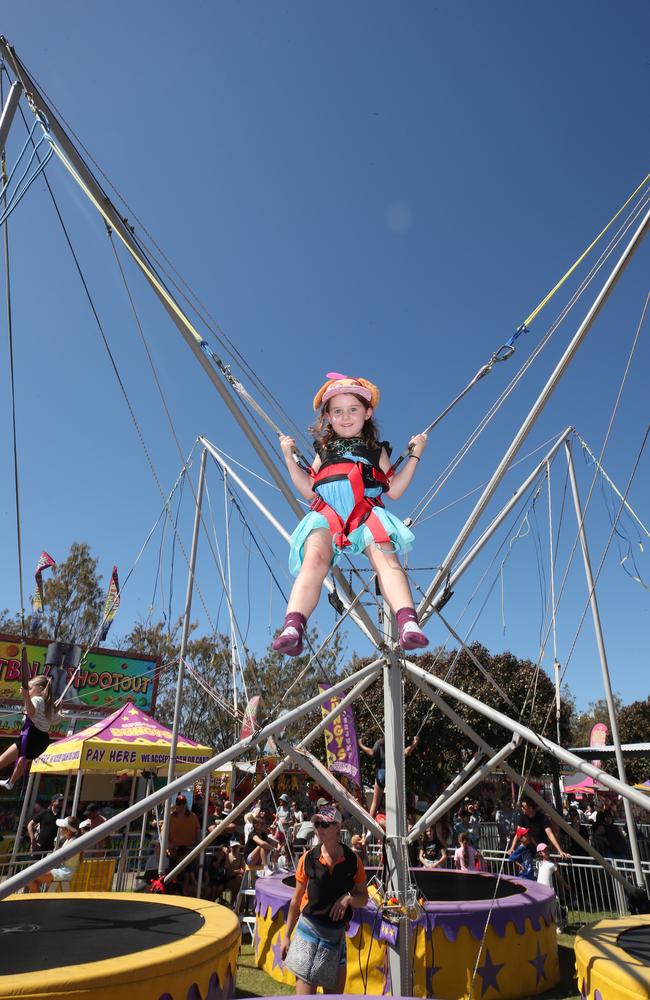 Huge crowds for the first day of the Gold Coast Show. Emily Trott, 4 learning to fly on the Superbungy. Picture: Glenn Hampson