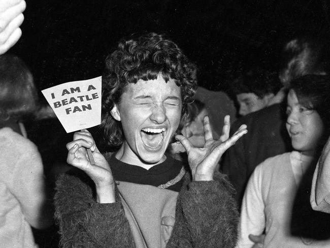 Excited fan at Eagle Farm Airport after the arrival of The Beatles. Picture by Barnes. Picture: News Corp
