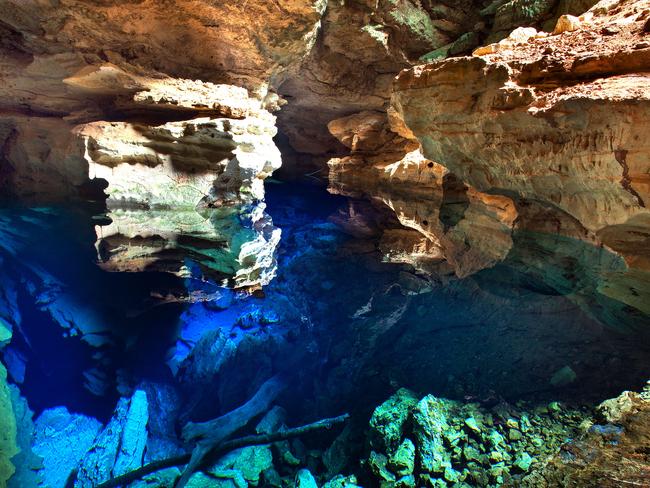 PIC FROM CATERS NEWS - (PICTURED: The incredible pool in Brazil ) - At first glance, youd be forgiven for thinking the wondrous cave was just an empty bottomless pit. But do a double take and youll actually find the depths of the Poo Azul cavern, in Chapada Diamantina National Park, Brazil, have actually been flooded with a mystical INVISIBLE POOL. Photographer Marcio Duranc, 40, captured the sheer magnificence of the vast, 16m deep underground cave, which was discovered by a prospector in 1920 when looking for diamonds in the region. SEE CATERS COPY.