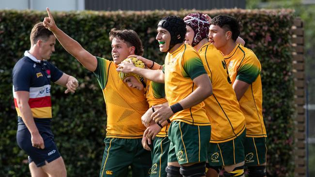 Tom Farr-Jones celebrates with teammates after scoring the winning try in the dying minutes despite the attempted tackle by Barbarians Tallis McEwan Picture: Julian Andrews