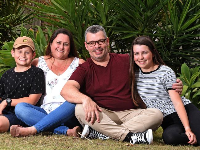 Peter and Cherie Rodrick with children Bowen 10 and Grace 16 at their home in Upper Coomera. Picture: AAP/John Gass