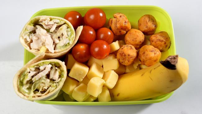 Lunchbox One: Choc apricot &amp; date bites, roast chicken, corn, avocado and mayo mountain bread wraps, cherry tomatoes, cubes of tasty cheese, a banana.