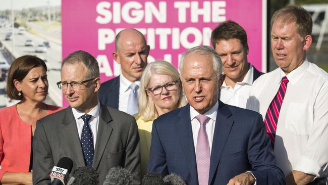 Australian Prime Minister Malcolm Turnbull speaks to the media about a funding plan for the M1 Pacific Motorway in Tanah Merah (AAP Image/Glenn Hunt)