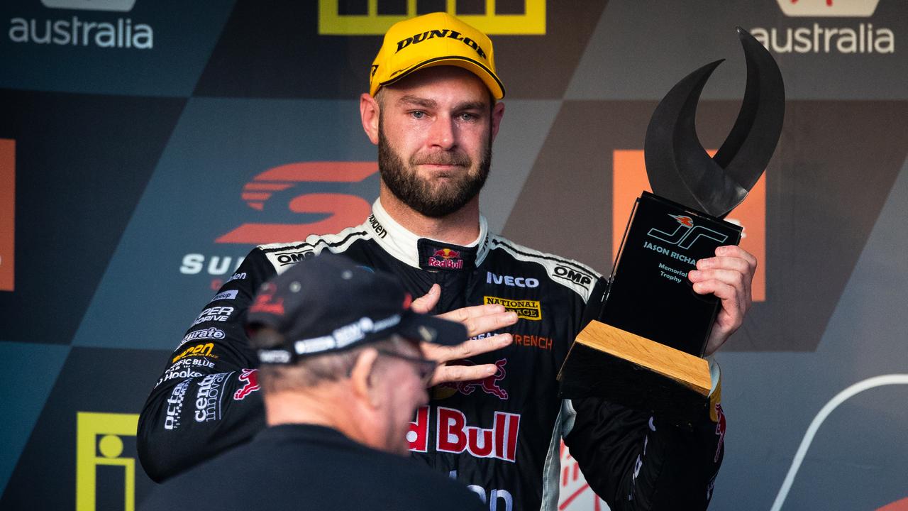 Shane van Gisbergen receives the Jason Richards Memorial Trophy from the late driver’s father.