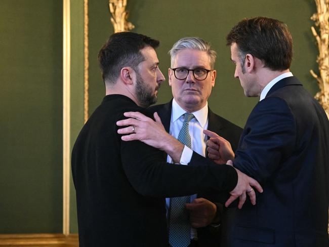 Government sources say if Australia does contribute to a peacekeeping force they would go in the “blue beret” of the UN peacekeeping force. Ukraine’s Volodymyr Zelensky, Britain’s Keir Starmer and France’s Emmanuel Macron embrace this week after talks. Picture: JUSTIN TALLIS / POOL / AFP)