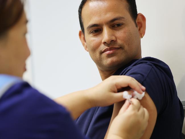 ADELAIDE, AUSTRALIA - NewsWire Photos March 17, 2021: Nepalese nurse Durga Basnet receives the Covid vaccine by Nga Tran at the Lyell McEwan Hospital in Elizabeth, Adelaide. Picture: NCA NewsWire / David Mariuz