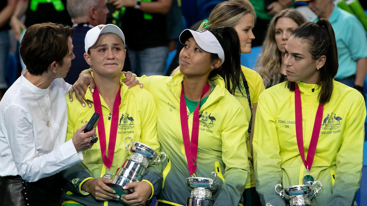 Ash Barty is comforted by Jayne Hrdlicka, Priscilla Hon and Ajla Tomljanovic.