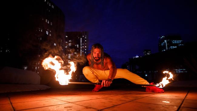 Richard Tanumi fire twirling in Sydney. Photo: Tim Pascoe