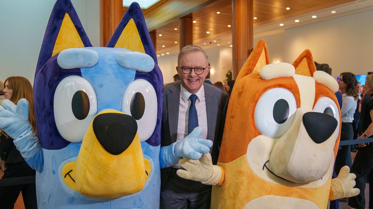 Bluey Christine Heeler, left, and Bingo Heeler, right, pose with a fan. Picture: Supplied