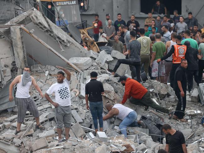 Palestinians look for survivors in the rubble after Israeli strikes in Rafah in the southern Gaza Strip on October 23. Picture: Mohammed Abed/AFP