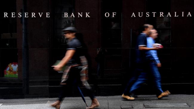 Pedestrians walk past the Reserve Bank of Australia in Sydney. Picture: AAP