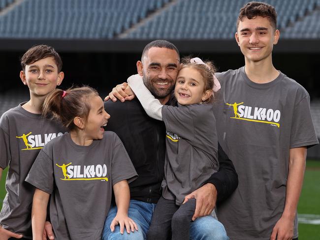 The 400 Club. Hawthorns Shaun Burgoyne plays game 400 on Saturday against Port Adelaide and joins Kevin Bartlett, Michael Tuck, Brent Harvey and Dustin Fletcher in the AFL 400 game club 02/07/2021.    Shaun  gets a kiss of daughter Nixie as other kids L-R Percy, Leni and Ky look on  .  Pic: Michael Klein